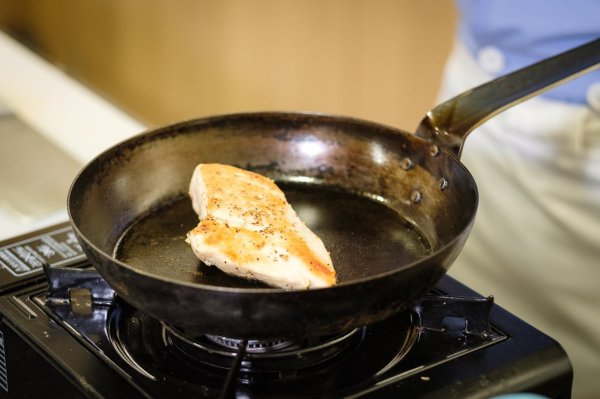The chicken is either unfried or burnt! Expert tutor